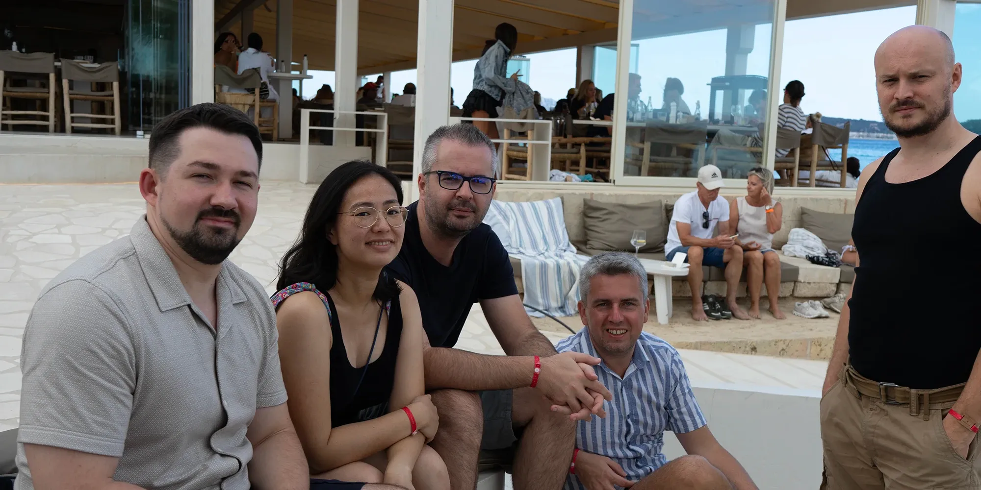 Backend lead enjoying a casual team event outdoors with colleagues.